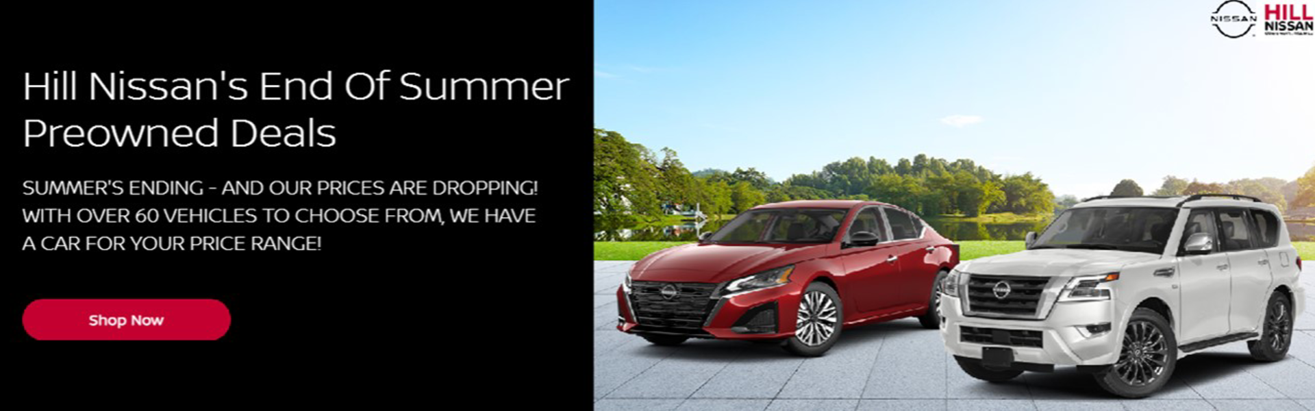 Red and white nissan on sunny day background with trees