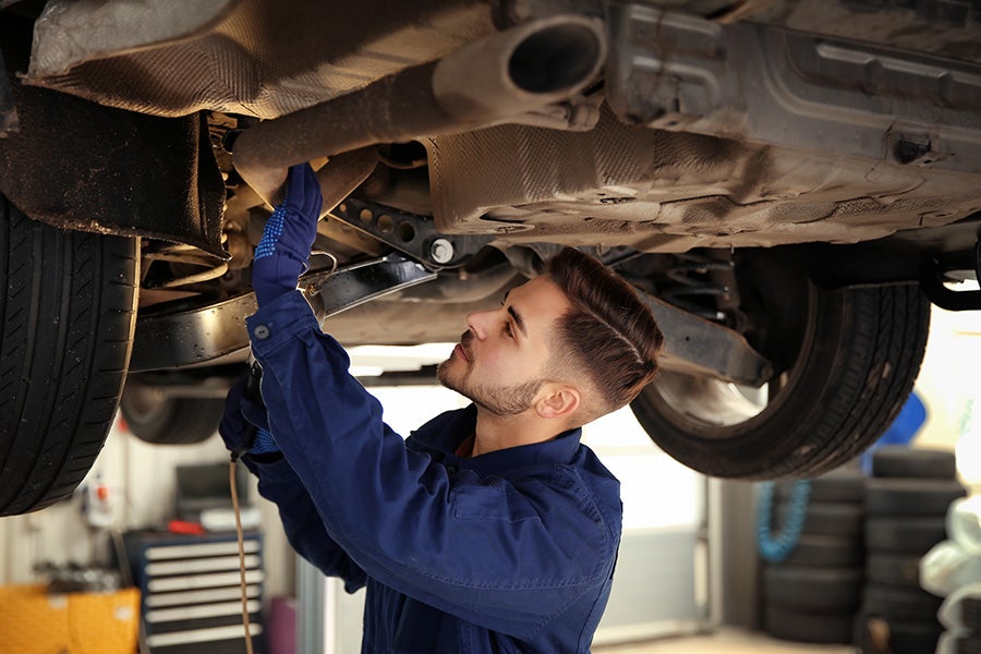 technician inspecting the car